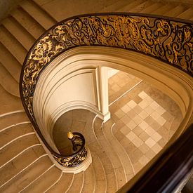 Spiral staircase down to the light in Nancy by Erik Dukker