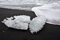 Ice sculptures on black sand at glacier lagoon Jokulsarlon, Iceland