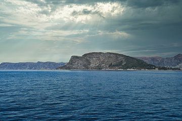 Western Cape in Norway. Fjord and sea with clouds and mountains on the coast by Martin Köbsch