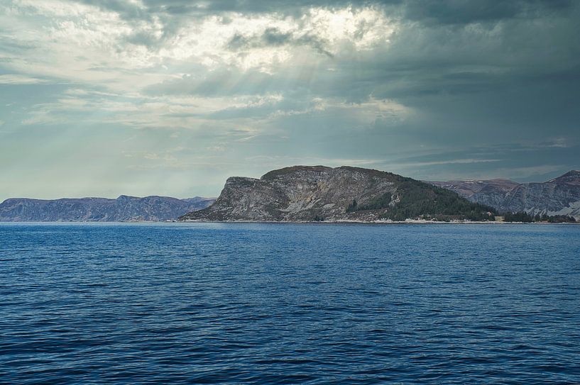 Western Cape in Norway. Fjord and sea with clouds and mountains on the coast by Martin Köbsch