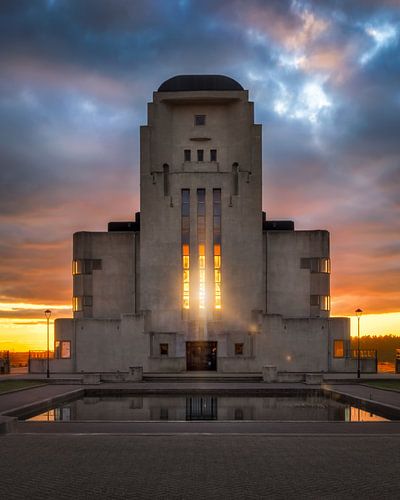 Zonsondergang door het raam