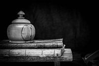 black and white vintage still life of books and a lidded jar