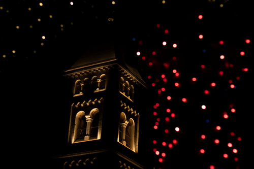 The bell tower aglow with lights at night