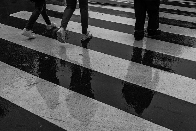 Silhouette of passers-by on zebra crossing by Colinda van Rees