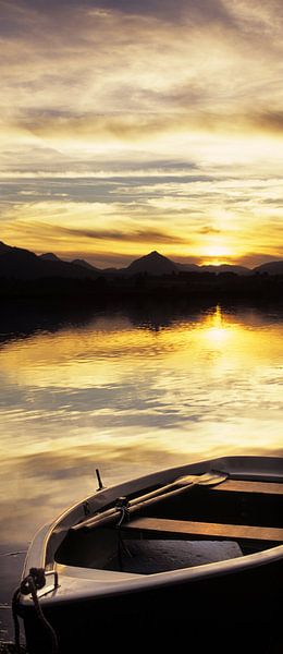 Boat at Hopfensee at sunset, Allgäu, Bavaria, Germany by Markus Lange