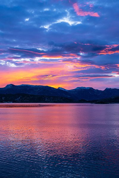 Mountains and rocks at sunrise near Torvik in Norway by Rico Ködder