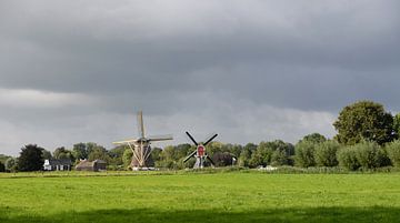 Dutch polder landscape with two windmills by Rini Kools