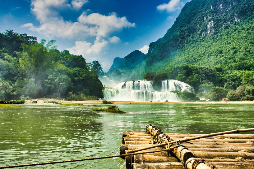 Bamboo raft at waterfall by Bart Nikkels