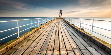 Whitby pier at sunrise by Irma Meijerman