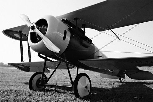 Classic double-decker airplane in black and white.