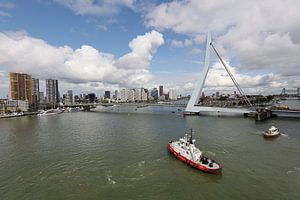 Skyline of Rotterdam with tugboat in foreground