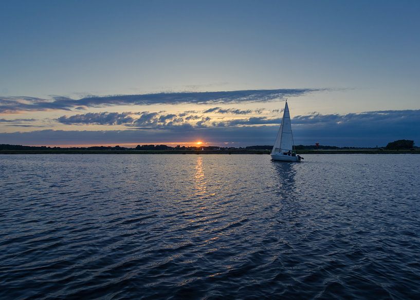 Zeilen bij zonsondergang van Patrick Herzberg