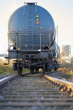 Train with tank wagons on railway tracks in the industrial port of Magdeburg by Heiko Kueverling