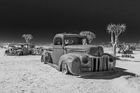 A car wreck in the desert.