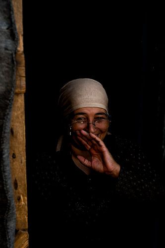 Woman laughing in refugee camp | Portrait photography art print