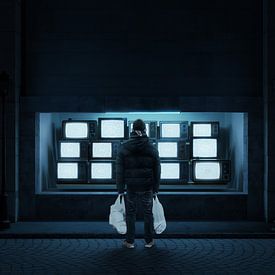 Young man with white bags in his hand stands in front of a TV shop window at night by Besa Art