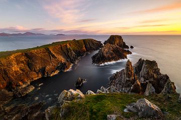 rugged rocky coast in the soft evening light by Daniela Beyer