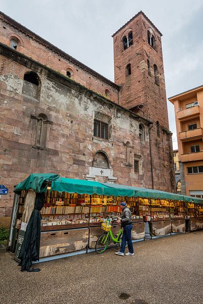 Bookstall along church in Lucca, Tuscany, Italy by Joost Adriaanse