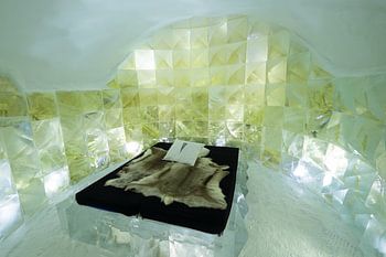 Bedroom hand carved from ice in the IceHotel 365 in Jukkasjärvi, Lapland, Sweden