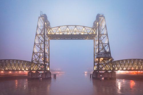 Old railroad bridge De Hef in a foggy blue hour