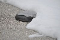 black stone in the surf