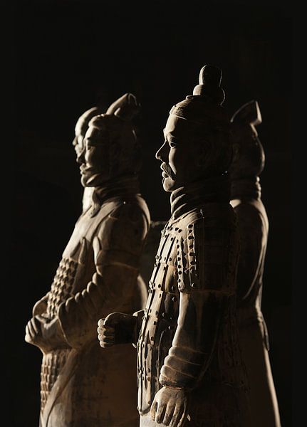 Beautiful lit Warriors from the  Terracotta army in Xi’an by Tony Vingerhoets