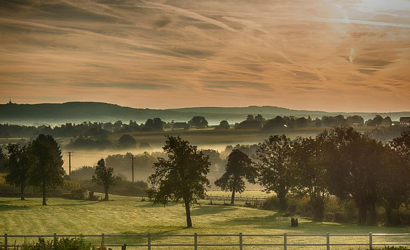landscape in the nature of the begium hills with haze , mist and hills at the background with trees  by ChrisWillemsen