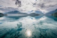 Reflection of mountains and clouds. Reflection of mountains and clouds in a lake. by Ellis Peeters thumbnail