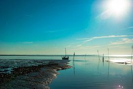 Port entrance in the Wadden Sea with sailing boat by Norbert Sülzner