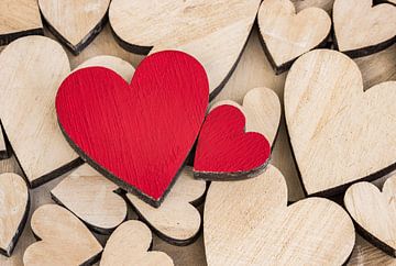 Romantic Valentines day background with wooden love hearts by Alex Winter