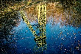 Reflection of the green winding tower of Carl Funke colliery in Essen in the water by Dieter Walther