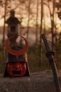 Antique samurai helmet next to katana sword in beautiful evening light by Besa Art thumbnail