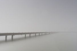 Jetty in the quiet morning mist at Lake Ammersee