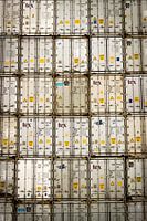 Stacked white containers in Rotterdam