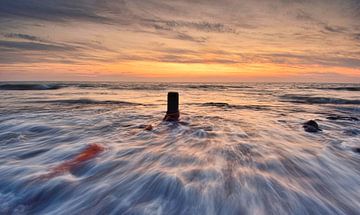 Noordzeestrand Texel bij zonsondergang