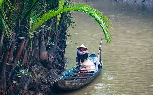 Schuilen voor de regen, Mekong delta, Vietnam
