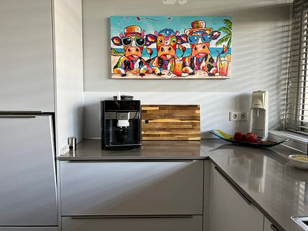 Cheerful cows with cocktails on the beach