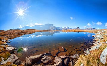 Double sun star in a mountain lake by Christa Kramer