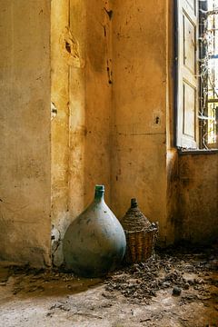 Wine decanters in an abandoned castle by Truus Nijland