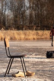 Chair with clogs on the ice