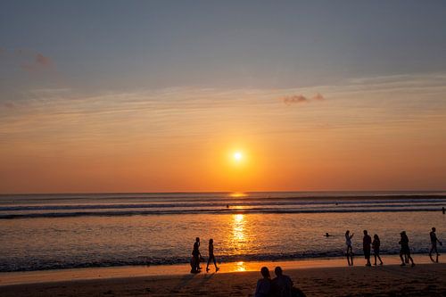 People enjoy the sunset in Seminyak (Kuta) Bali - Indonesia