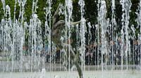 Dancing woman in fountain