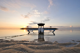 A traditional jukung boat in the golden morning light, Sanur, Bali by Fotos by Jan Wehnert