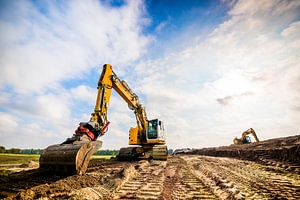 Gelbe Bagger beim Straßenbau