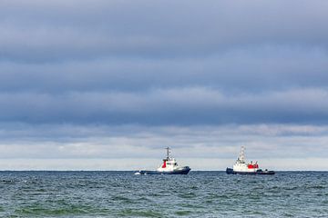 Two tugs on the Baltic Sea off Warnemünde by Rico Ködder