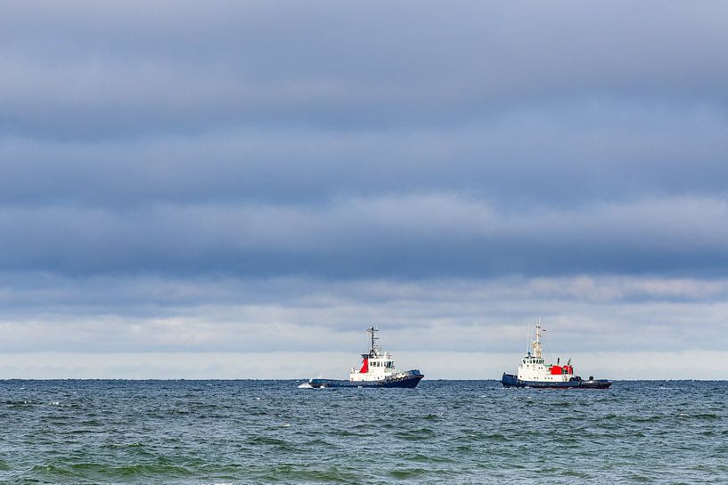 Two tugs on the Baltic Sea off Warnemünde by Rico Ködder