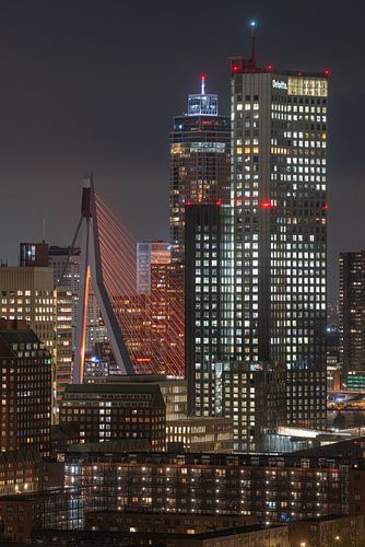 The Erasmus Bridge in orange in Rotterdam with the Zalmhaven Tower and Maastoren (|) by MS Fotografie | Marc van der Stelt