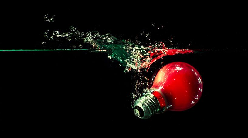 Red lamp in aquarium by Ruurd Corpel