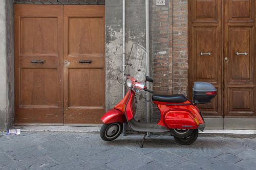 Red Vespa scooter in Italy