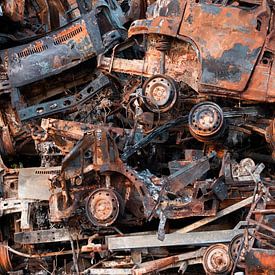 Abstract image of stacked rusty cars and caravans by Marianne van der Zee